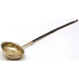 Early 19th century toddy ladle, the oval bowl with crimped rim and centred with a George II silver