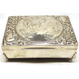 Edward VII dressing table casket of rectangular form, the hinged cover heavily embossed with floral,