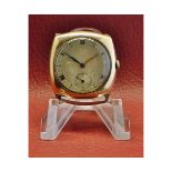 9ct gold cushion-shaped wristwatch, the jewelled movement to a silvered Roman dial and a polished