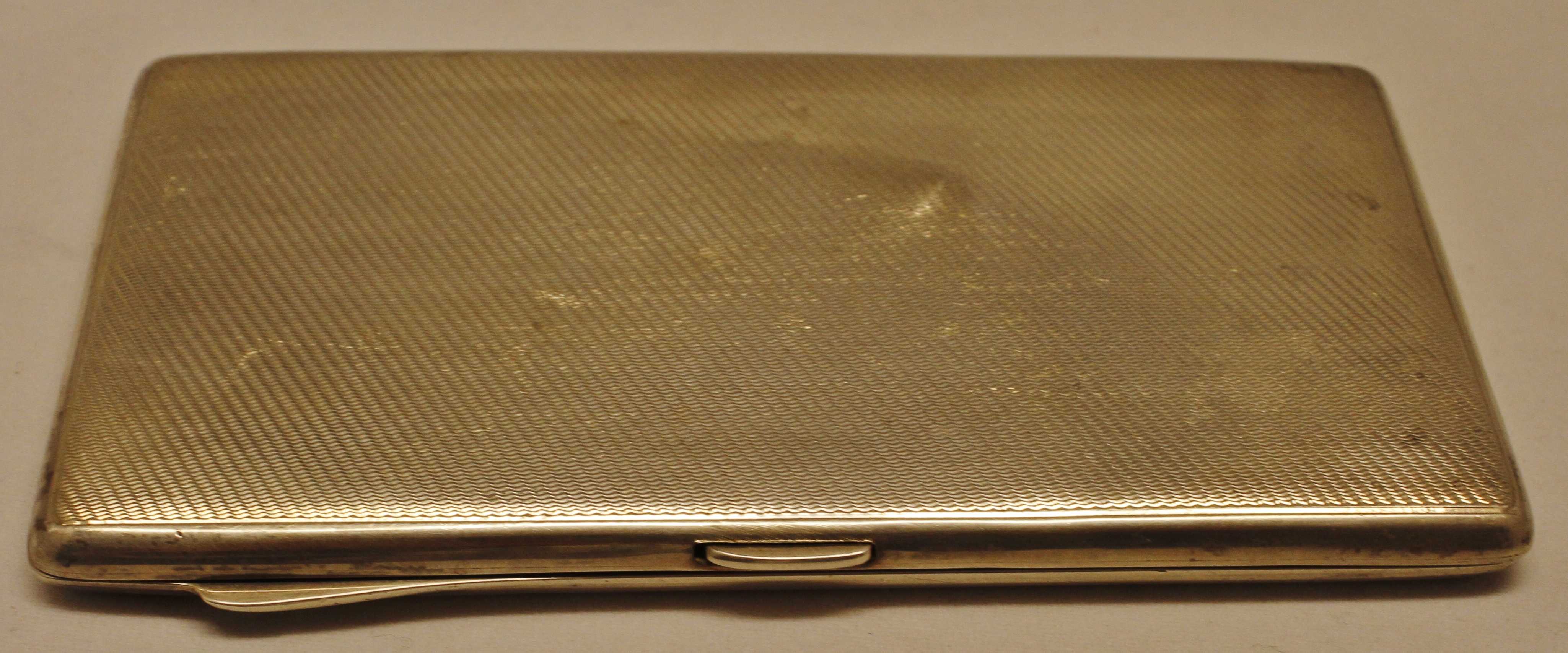 Edward VIII silver cigarette case of hinged rectangular form with all over engine turned