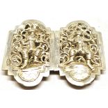 Far Eastern white metal nurses type buckle, each comprising a solid border with pierced field and