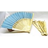 Late 19th century Chinese export ivory and silk fan of 20 stick construction, each finely pierced