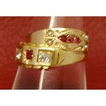 Mixed Lot: a mid-grade yellow metal Victorian diamond and ruby ring, the oval cut ruby set either