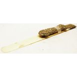 Late 19th/early 20th century white metal mounted and ivory paper knife, the plain ivory blade to