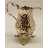 George III baluster cream jug, with cut card rim and cast and applied acanthus leaf capped "C"