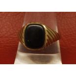 Gents 9ct gold ring, the textured mount set with a rectangular onyx panel, finger size S, 3gms gross
