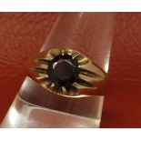 Gents 9ct gold ring, set with a circular dark red cut stone, hallmarked for Birmingham 1970,