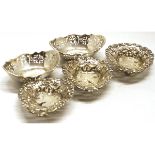 Mixed Lot: three small bon-bon baskets, each with pierced oval form and decorated with floral c-