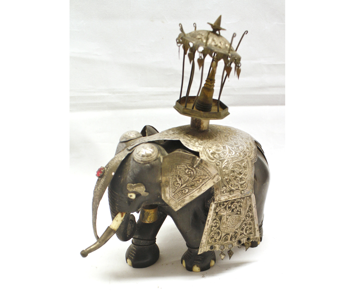 20th century hardwood model of standing elephant, with applied white metal mounts to its body and
