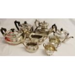 Mixed Lot: two various electroplated three-piece tea sets, together with two further teapots,