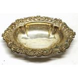 Late Victorian small table basket, of shaped oval form with embossed floral and foliate border and