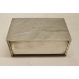 George V table cigarette box, of all-over plain polished rectangular form, the hinged cover with