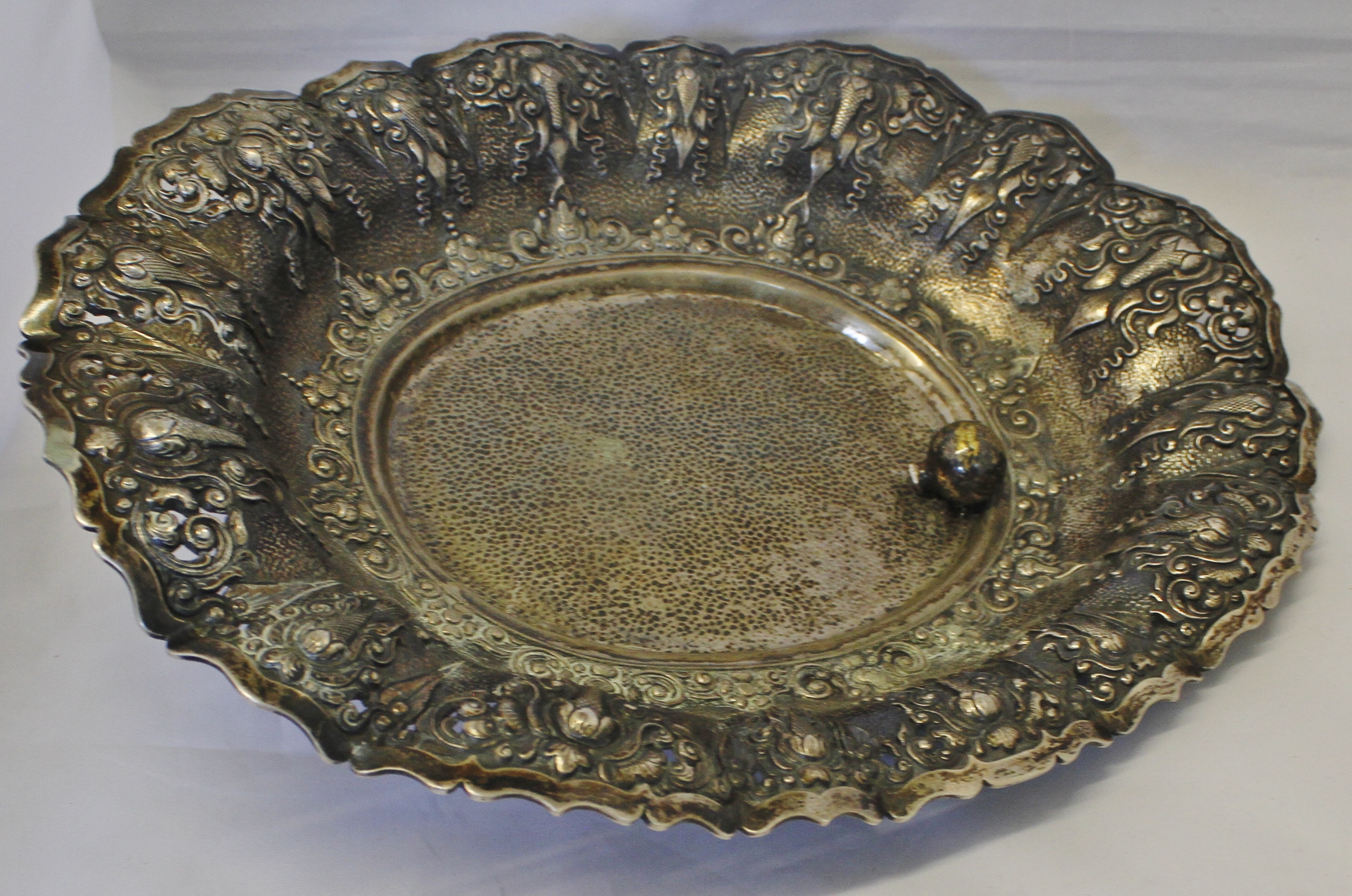 Continental oval table basket of lobed oval form, with pierced and embossed decoration and raised on