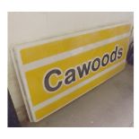 LARGE PLASTIC ADVERTISING SIGN IN YELLOW WITH CAWOODS WRITTEN ON IT