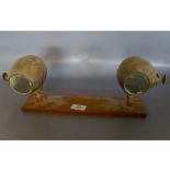 PAIR OF CAV TORPEDO LIGHT BRASS LAMPS ON WOODEN PLINTH