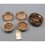 Mixed Lot: five various assorted silver plated and wooden based coasters or bottle stands