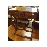 Victorian walnut veneered flip top work table with fitted interior, raised on pierced ends and swept