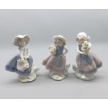 Three Lladro figures, young girls with baskets of flowers