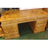20th century pine twin pedestal desk or dressing table, with nine drawers, 60" wide