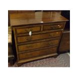19th century oak walnut and mahogany cross banded chest of two short and three long drawers,