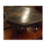 Octagonal coffee table in the Oriental taste, decorated with various figures and black lacquer