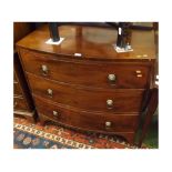 19th century mahogany bow front chest of three drawers with lion mask and ringlet handles, 36" wide