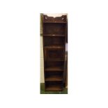 Narrow early 20th century oak bookcase cabinet with central cupboard, 14 1/2" wide