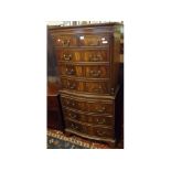 Reproduction mahogany serpentine front chest on chest, fitted with eight drawers and central