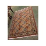 Good quality 20th century Middle Eastern wool floor rug, decorated with central lozenges around a