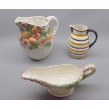 Mixed Lot: two decorated jugs and a further sauceboat (3)