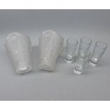 Mixed Lot: two early 20th century frosted glass shades and four cut clear glass shot glasses (6)