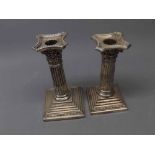 Mixed Lot: hallmarked silver Corinthian column style candlestick with loaded base and a similar