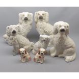 Mixed Lot: seven various 19th century Staffordshire model dogs, largest 11" high