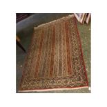 Good quality 20th century Middle Eastern wool floor rug, decorated with stylised foliage, 87" long