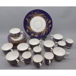 Quantity of 19th century blue and gilt decorated tea wares, pieces bearing date cypher to bases