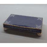 Continental porcelain rectangular stand, decorated in blue with gilt highlights, raised on small bun