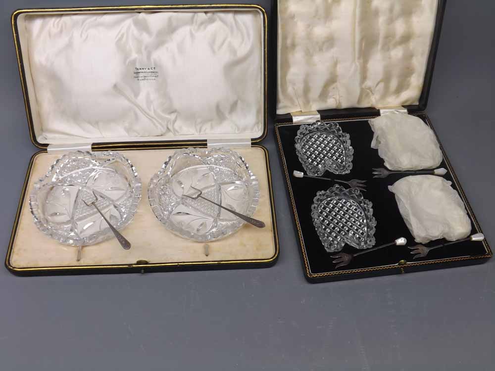 Cased set of four cut glass hors d-oeuvres dishes and accompanying hallmarked silver forks