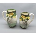 Two Royal Doulton floral decorated jugs, Pattern No D1736/P, largest 8" high (2)