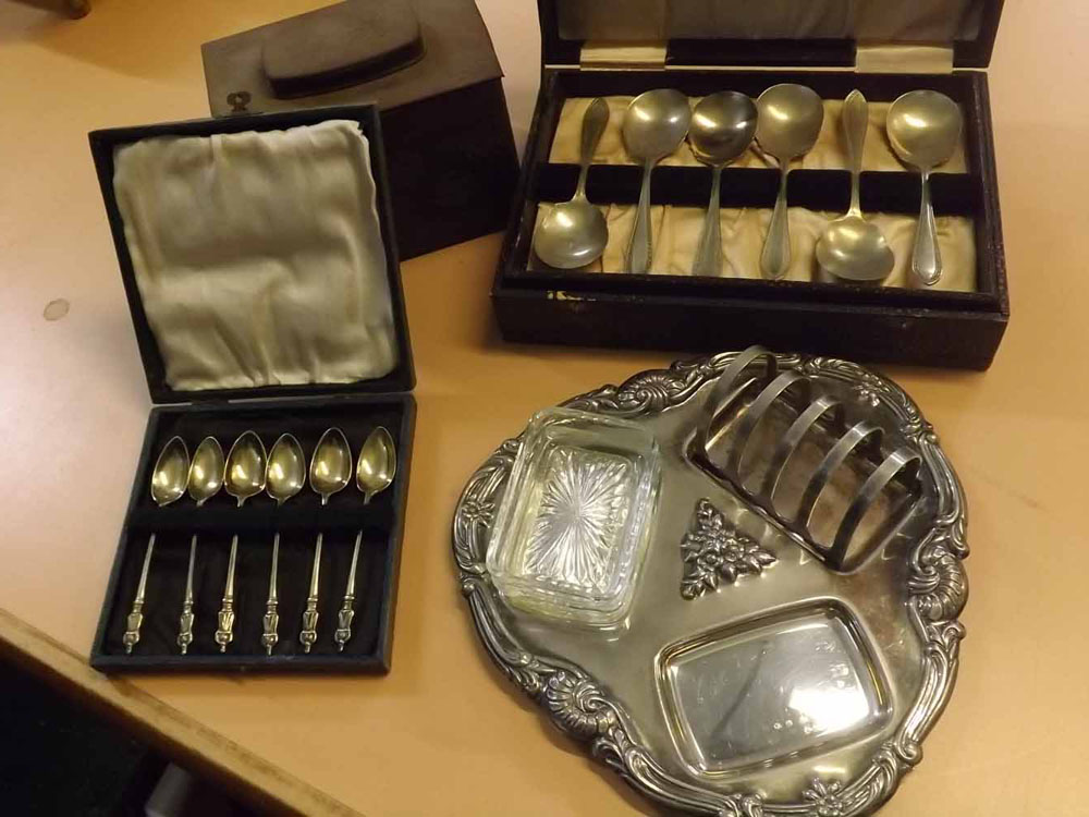 Mixed Lot: silver plated combination toast rack and butter dish, cased cutlery and a metal tea caddy