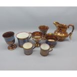 Mixed Lot: 19th century copper lustre ceramics, to include jugs, mugs, pedestal cups etc (8)