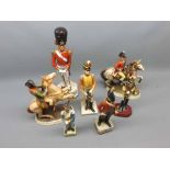 Collection of seven various assorted ceramic and composition models: soldiers, beefeater etc