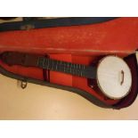 Small cased banjo