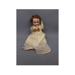 Heubach bisque faced doll with googly eyes in Victorian dress, measuring approx 8 tall