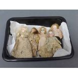 Group of five assorted porcelain faced doll house dolls, in period clothing, measuring approx 3 “