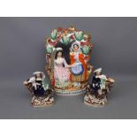 Staffordshire Fortune Tellers group, and a pair of Staffordshire mounted figures (3)