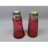 Pair of cranberry glass sugar casters with silver plated tops (2)