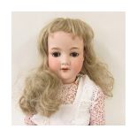 Armand Marseille 390 bisque socket head doll, with fixed brown glass eyes, lashes attached,