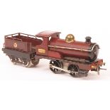 Hornby O gauge clockwork locomotive and tender of nut and bolt construction features brass number