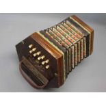 Possibly German made hexagonal rosewood ended and pierced decorated twenty-one button concertina