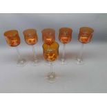 Set of six amber bowled and clear stemmed and based hock glasses